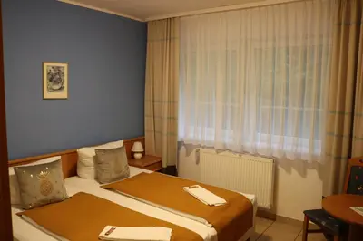 Ein Bett oder Betten in einem Zimmer der Unterkunft Waldhotel Harz Ilsenburg