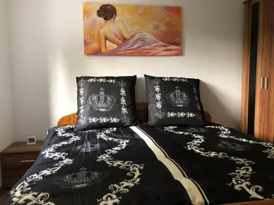 Ein Bett oder Betten in einem Zimmer der Unterkunft Ferienwohnung Black Beauty