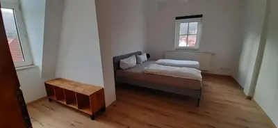 Ein Bett oder Betten in einem Zimmer der Unterkunft Ferienwohnung zur Silbertanne