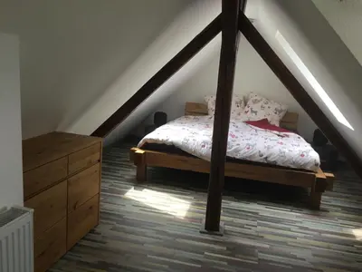 Ein Bett oder Betten in einem Zimmer der Unterkunft Atelier Wolkenschloss