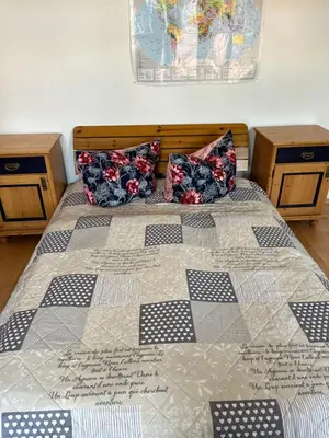 Ein Bett oder Betten in einem Zimmer der Unterkunft Ferienwohnung Kaufmannshof