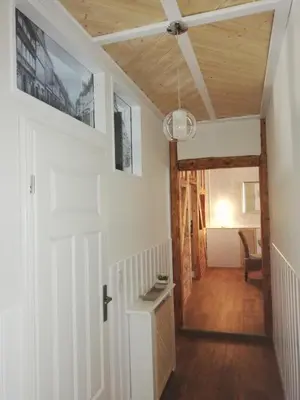 Ein Bett oder Betten in einem Zimmer der Unterkunft Ferienwohnung / Hotel Zur Tanne