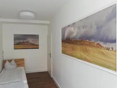 Ein Bett oder Betten in einem Zimmer der Unterkunft Ferienwohnung / Hotel Zur Tanne
