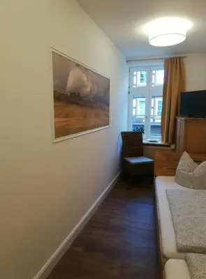 Ein Sitzbereich in der Unterkunft Ferienwohnung / Hotel Zur Tanne
