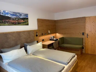 Ein Bett oder Betten in einem Zimmer der Unterkunft Hotel und Berggasthof Zum Sonnenhof
