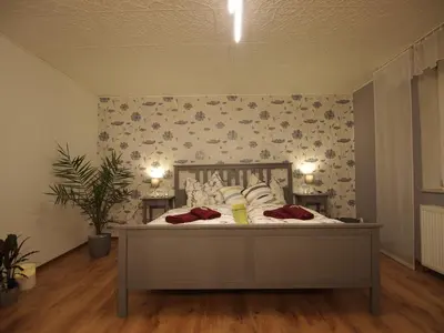 Ein Bett oder Betten in einem Zimmer der Unterkunft Quedlinburger Fachwerkhaus