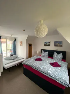 Ein Bett oder Betten in einem Zimmer der Unterkunft Ferienhaus Schloßblick