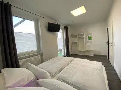 Ein Bett oder Betten in einem Zimmer der Unterkunft Alte Molkerei FeWo 2