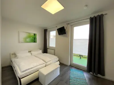 Ein Bett oder Betten in einem Zimmer der Unterkunft Alte Molkerei FeWo 2
