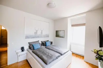 Ein Bett oder Betten in einem Zimmer der Unterkunft Ferienwohnung Waldgasthaus Armeleuteberg