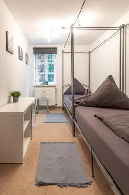 Ein Bett oder Betten in einem Zimmer der Unterkunft Ferienwohnung zum rost'gen Potte I