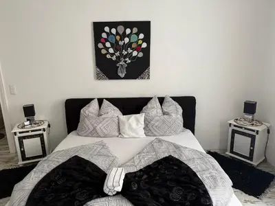 Ein Bett oder Betten in einem Zimmer der Unterkunft Ferienwohnung Roxana Stadtkern von Quedlinburg 55qm