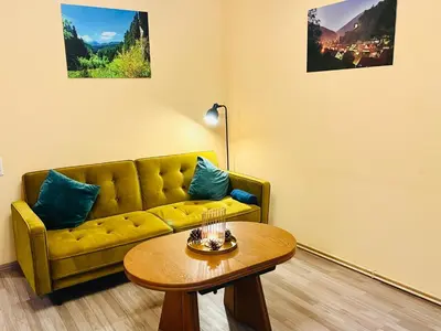 Ein Sitzbereich in der Unterkunft Vor lauter Bäumen B&B