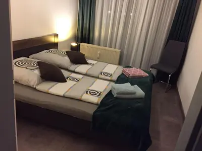 Ein Bett oder Betten in einem Zimmer der Unterkunft International 5