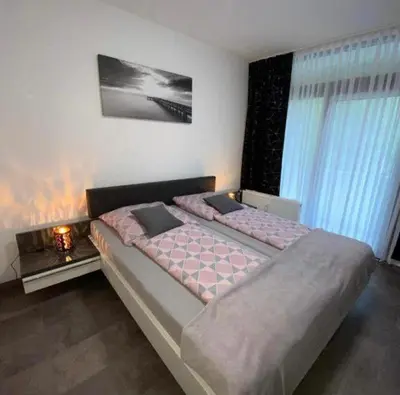 Ein Bett oder Betten in einem Zimmer der Unterkunft International 6
