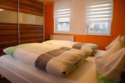 Ein Bett oder Betten in einem Zimmer der Unterkunft Ferienwohnung Andres