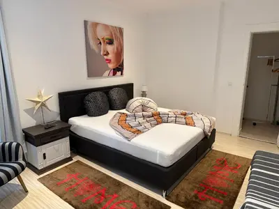 Ein Bett oder Betten in einem Zimmer der Unterkunft Ferienwohnung Roman Stadtkern von Quedlinburg 80qm