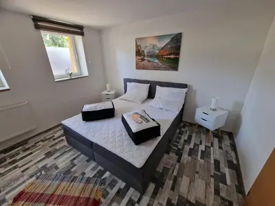Ein Bett oder Betten in einem Zimmer der Unterkunft Fewo am Reiterhof