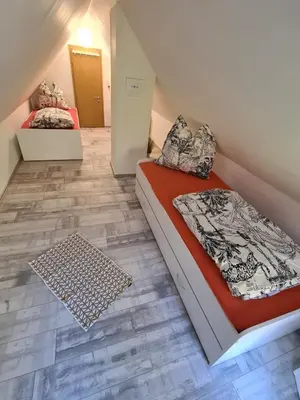 Ein Bett oder Betten in einem Zimmer der Unterkunft Fewo am Reiterhof