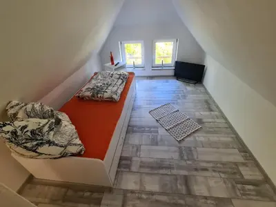 Ein Bett oder Betten in einem Zimmer der Unterkunft Fewo am Reiterhof