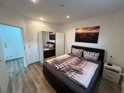 Ein Bett oder Betten in einem Zimmer der Unterkunft FEWO an der Malzmühle 1d