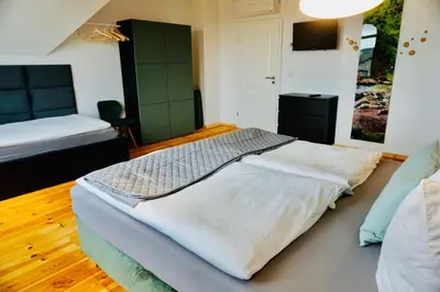 Ein Bett oder Betten in einem Zimmer der Unterkunft FeWo26 im Sagenharz - stilvolles Family-Apartment, 2 SZ, Klimaanlage, WLAN, Netflix & Free Parking