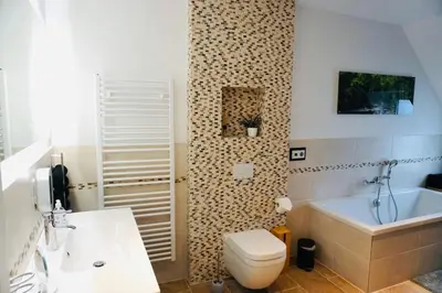 Ein Badezimmer in der Unterkunft FeWo26 im Sagenharz - stilvolles Family-Apartment, 2 SZ, Klimaanlage, WLAN, Netflix & Free Parking