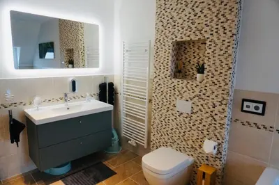 Ein Badezimmer in der Unterkunft FeWo26 im Sagenharz - stilvolles Family-Apartment, 2 SZ, Klimaanlage, WLAN, Netflix & Free Parking