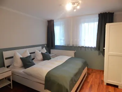 Ein Bett oder Betten in einem Zimmer der Unterkunft Ferienwohnung Haus Bettina