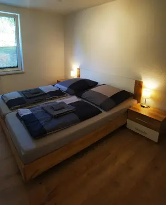 Ein Bett oder Betten in einem Zimmer der Unterkunft Ferienwohnungen im Mühlental