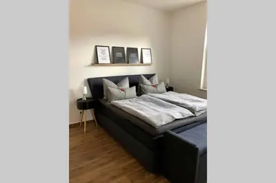 Ein Bett oder Betten in einem Zimmer der Unterkunft Liebevoll sanierte, großzügige Stadtwohnung, 70 qm