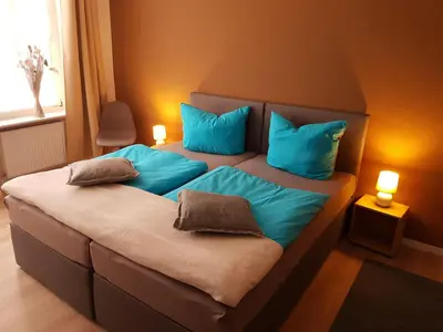 Ein Bett oder Betten in einem Zimmer der Unterkunft Ferienwohnung Quedlinburg