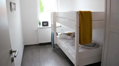 Ein Bett oder Betten in einem Zimmer der Unterkunft FeWo Rübezahl mit Kamin #Innenstadtnähe#Netflix von Harztraveler