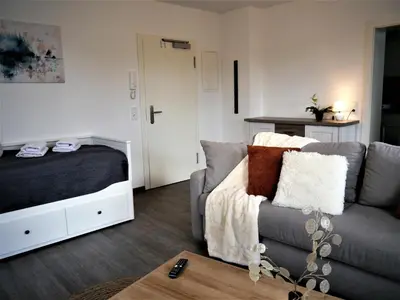 Ein Bett oder Betten in einem Zimmer der Unterkunft FeWo Harzer-Perle mit Dampfdusche #Innenstadtnähe#Netflix von Harztraveler