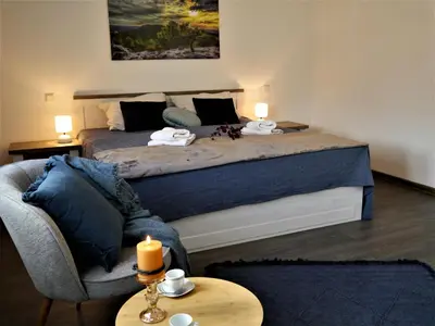 Ein Bett oder Betten in einem Zimmer der Unterkunft FeWo Fuchsbau mit Dampfdusche #Kamin#Innenstadtnähe#Netflix von Harztraveler
