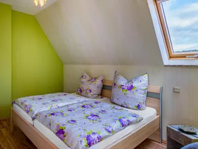 Ein Bett oder Betten in einem Zimmer der Unterkunft gemütliche Ferienwohnung in Cattenstedt