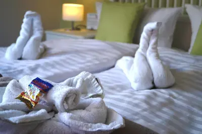 Ein Bett oder Betten in einem Zimmer der Unterkunft REGIOHOTEL Pfälzer Hof Wernigerode - #Familienfreundlich #PreiswertÜbernachten #Harzurlaub #FreeParking
