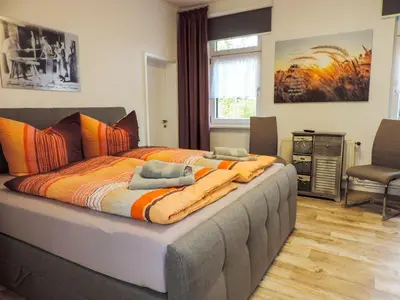 Ein Bett oder Betten in einem Zimmer der Unterkunft Ferienwohnung Zur Backstube