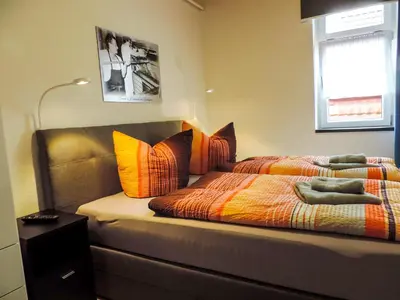Ein Bett oder Betten in einem Zimmer der Unterkunft Ferienwohnung Zur Backstube