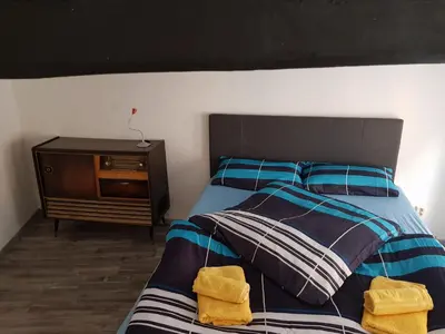 Ein Bett oder Betten in einem Zimmer der Unterkunft Kaufmannshof mit Fachwerkcharme