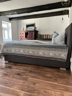 Ein Bett oder Betten in einem Zimmer der Unterkunft Kaufmannshof mit Fachwerkcharme