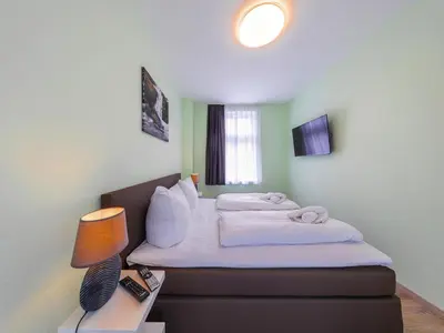 Ein Bett oder Betten in einem Zimmer der Unterkunft Ferienwohnung Fachwerktraum, Wernigerode