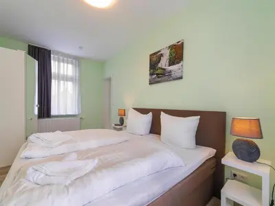 Ein Bett oder Betten in einem Zimmer der Unterkunft Ferienwohnung Fachwerktraum, Wernigerode