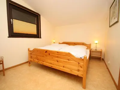 Ein Bett oder Betten in einem Zimmer der Unterkunft Ferienwohnung im Haus Schiefertal, Wieda