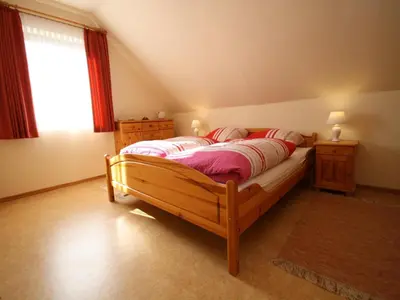 Ein Bett oder Betten in einem Zimmer der Unterkunft Ferienwohnung im Haus Schiefertal, Wieda