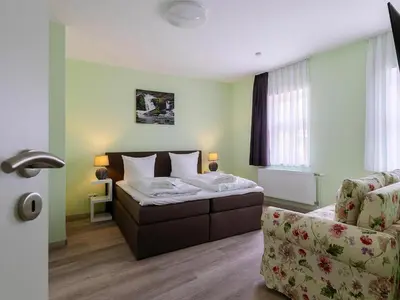Ein Bett oder Betten in einem Zimmer der Unterkunft Ferienwohnung Schlossblick, Wernigerode