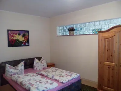 Ein Bett oder Betten in einem Zimmer der Unterkunft Ferienwohnung Markert