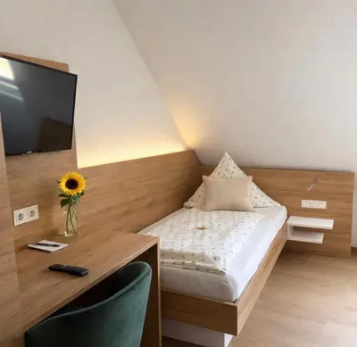 Ein Bett oder Betten in einem Zimmer der Unterkunft Hotel Zum Klosterfischer