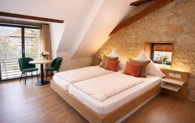 Ein Bett oder Betten in einem Zimmer der Unterkunft Hotel Zum Klosterfischer