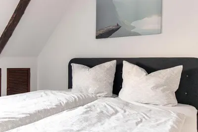 Ein Bett oder Betten in einem Zimmer der Unterkunft Ferienwohnungen im Weingarten Quedlinburg